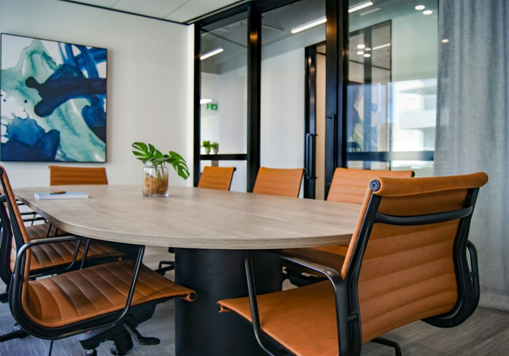 brown wooden 9-piece office table and chairs